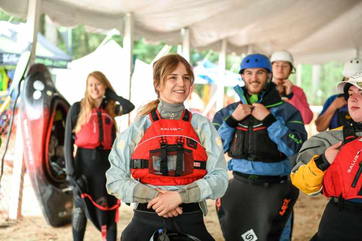 people under a tent receiving instruction