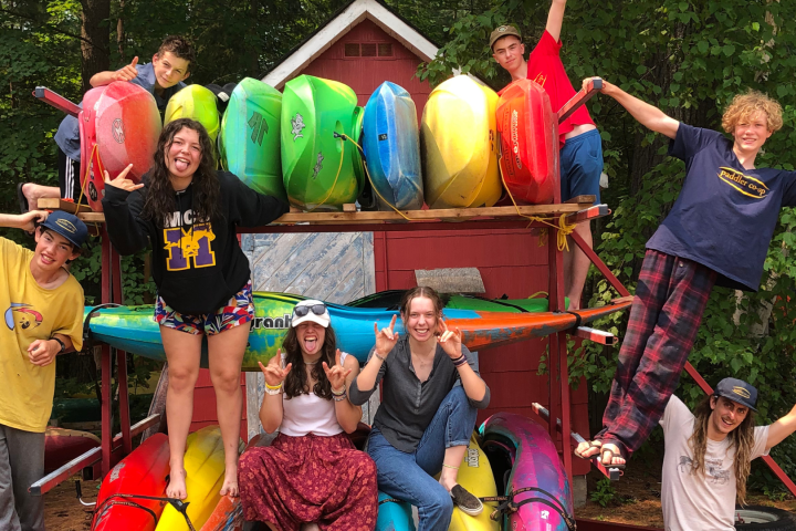 a group of people that are standing in the grass