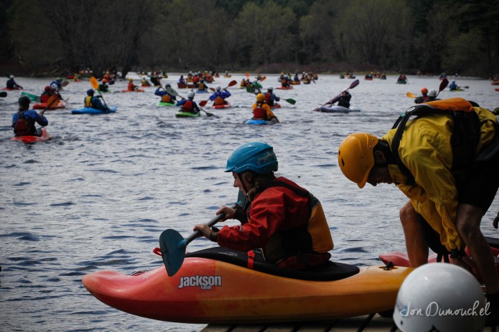 a group of people riding on the back of a boat