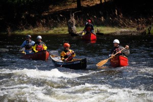 a group of people riding on the back of a boat