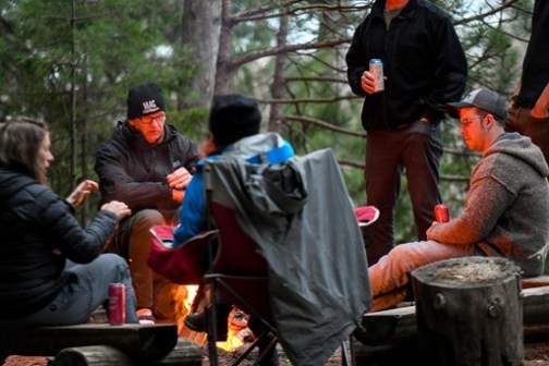 a group of people sitting on a bench