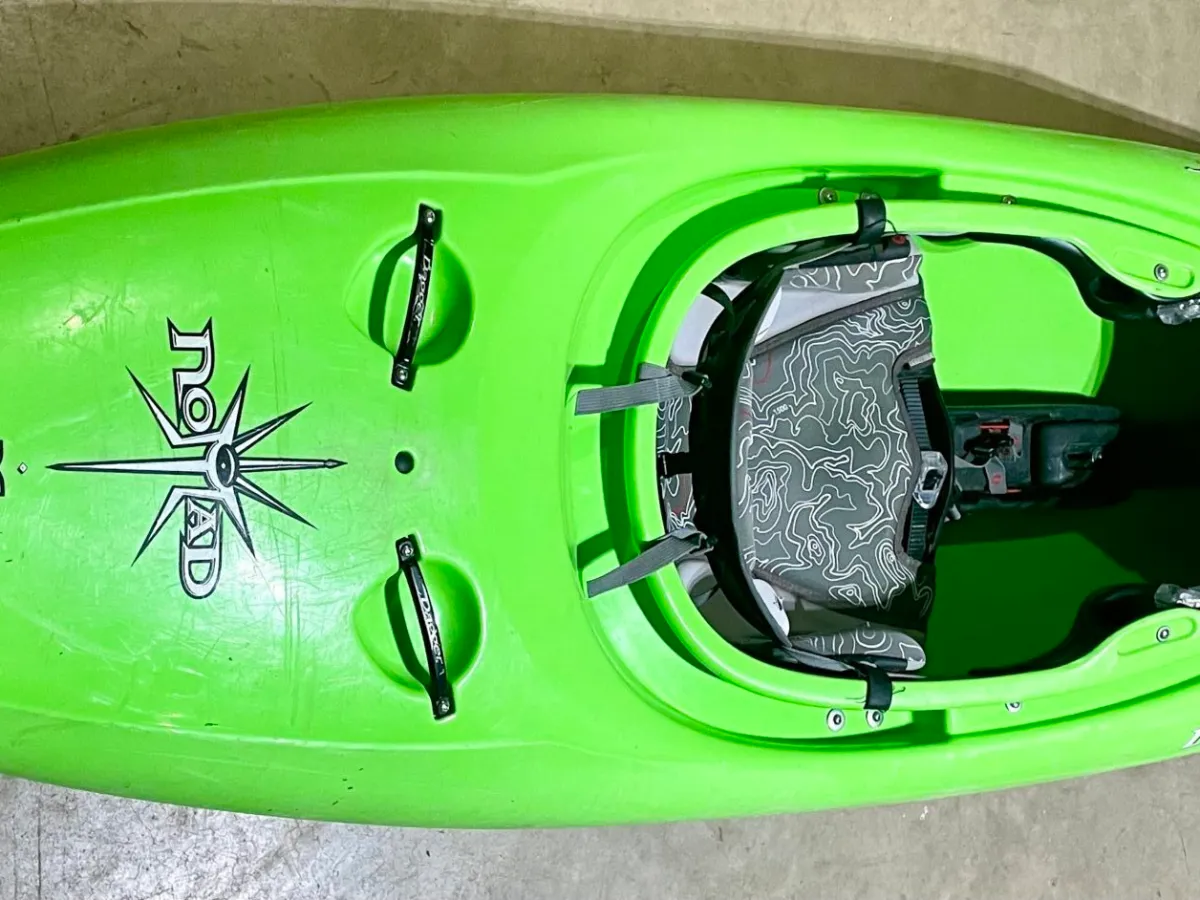 a piece of luggage sitting on top of a green background