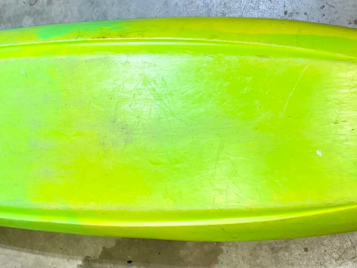 a close up of a green frisbee