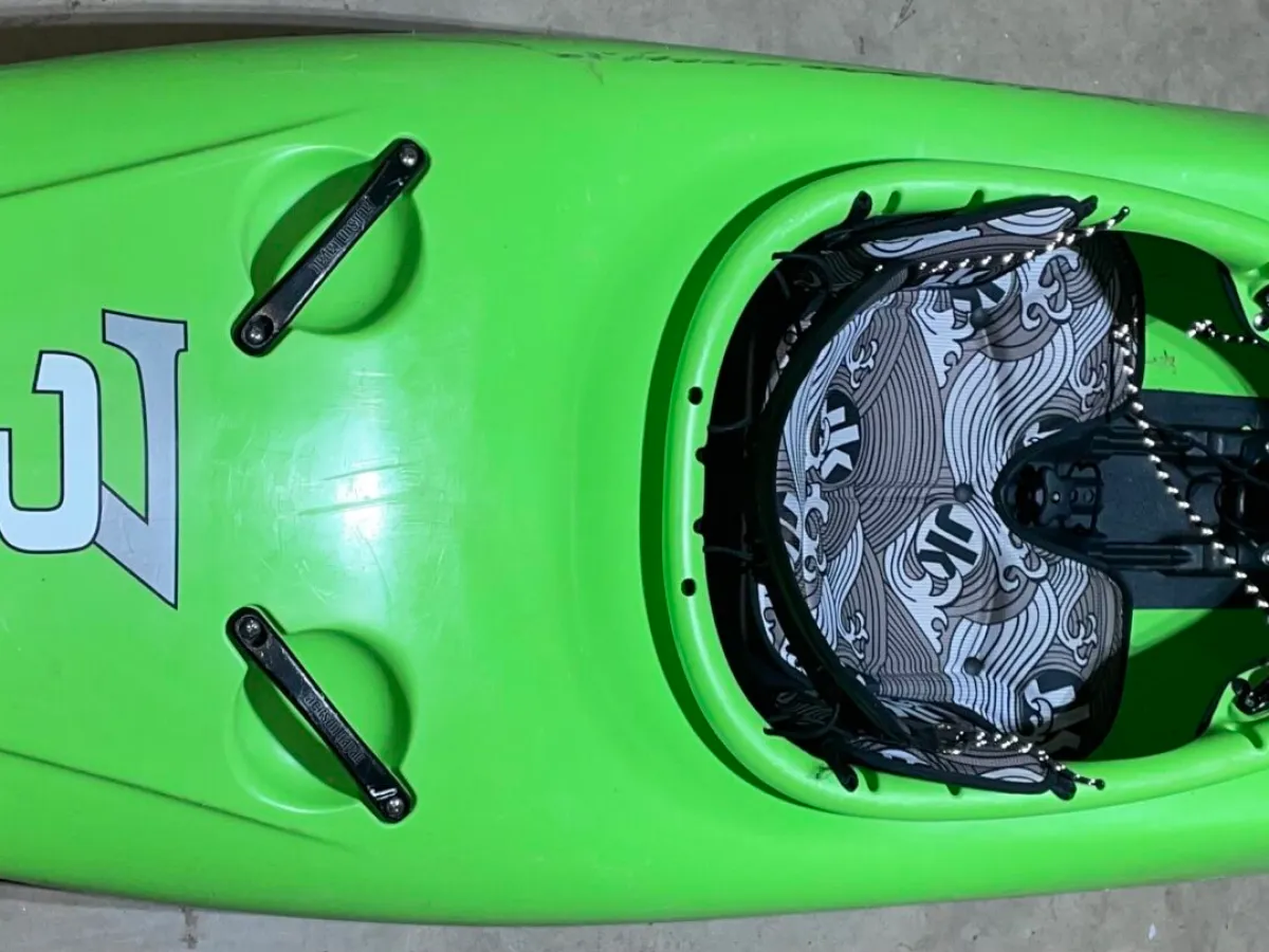 a close up of a green car on display