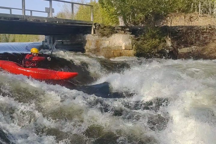 a man riding a wave on top of a body of water