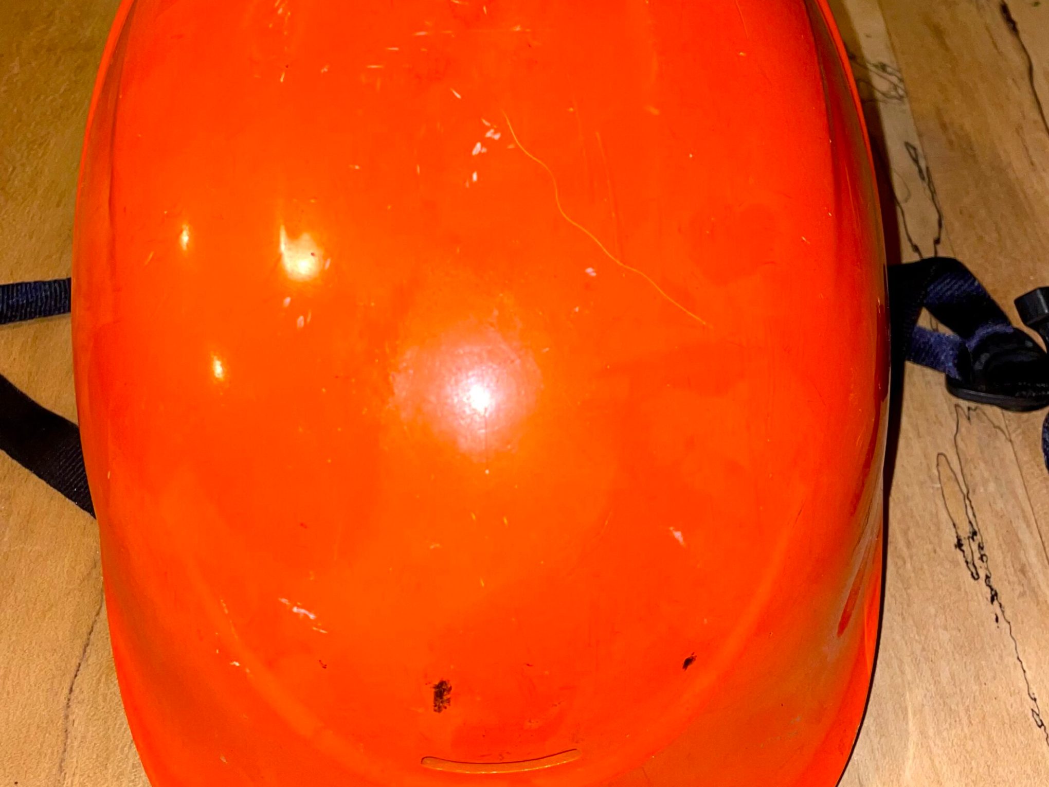 an orange and white helmet