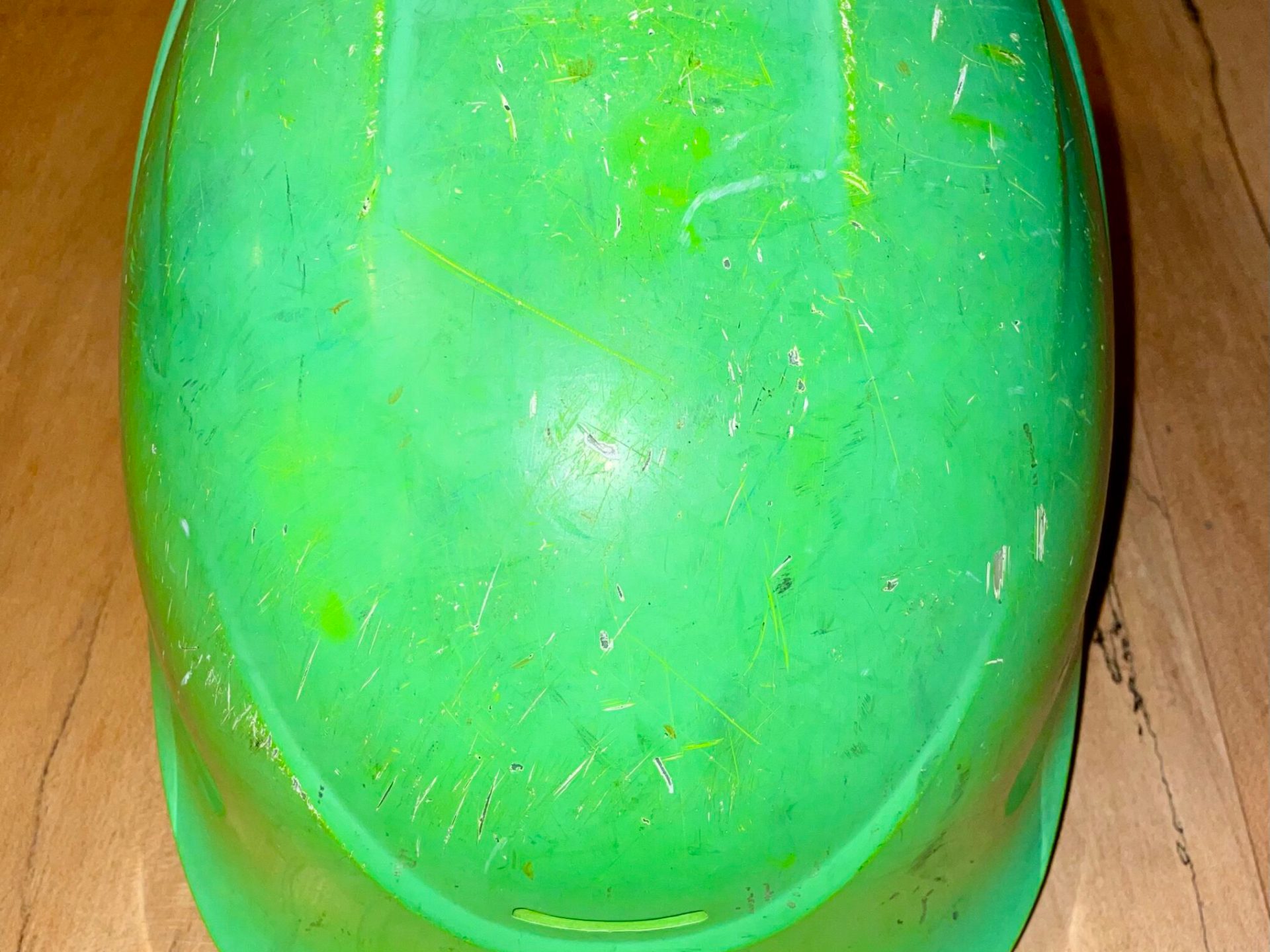 a green bottle on a table